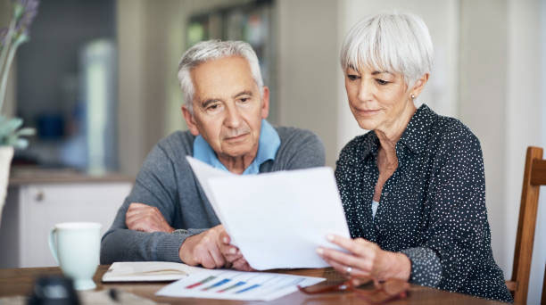 Elderly Couple Reviewing Paperwork