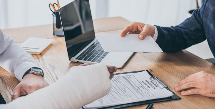 Man in a cast discussing workers compensation