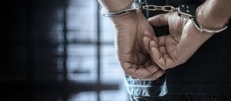 Man arrested in handcuffs
